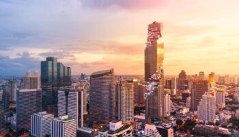 Bangkok skyline featuring the Mahanakhon building at sunset. The Standard Bangkok is a gay-friendly hotel with stunning city views.