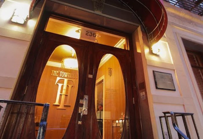 The Townhouse Bar in New York. Elegant wooden doors of this gay bar welcome visitors. A must-visit for gay men traveling to New York.
