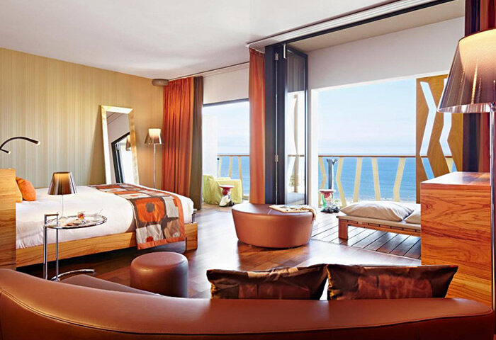 Bohemia Suites & Spa adults-only hotel room. Luxury gay honeymoon hotel in Playa del Ingles Beach, Gran Canaria. Balcony with ocean view.