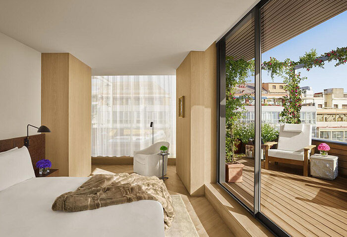 Barcelona EDITION luxury hotel room with private terrace. Best gay hotel. Modern design, bright space, city view. Perfect for gay travel.