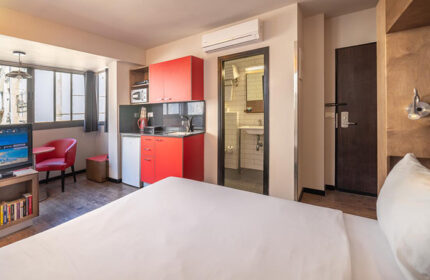 Ben Yehuda Apartments, Tel Aviv. Service apartment penthouse interior near Hilton Beach in the Gayborhood. Room with kitchenette and bathroom.