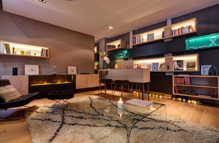 Hotel Elixir's cheap city center gay hotels in Paris living room. Modern design, fireplace, books, and stylish furniture. Gay travel advice.