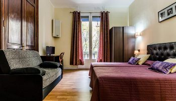 Hotel Victoria Palace, Barcelona. Updated room in gay hotel near gay bars and saunas. Twin beds, sofa, balcony, city center.