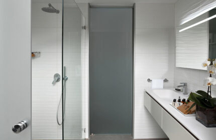 Carlton Tel Aviv Hotel luxury bathroom. Shower, sink, mirror, & amenities. Most booked gay luxury hotel near Hilton Beach.