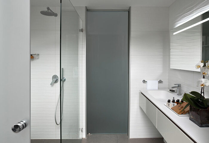 Carlton Tel Aviv Hotel luxury bathroom. Shower, sink, mirror, & amenities. Most booked gay luxury hotel near Hilton Beach.