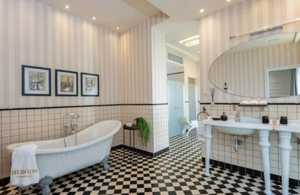 Herods Tel Aviv bathroom. Honeymoon hotel idea in Hilton Beach Gayborhood. Clawfoot tub, black and white tile. Gay travel advice.