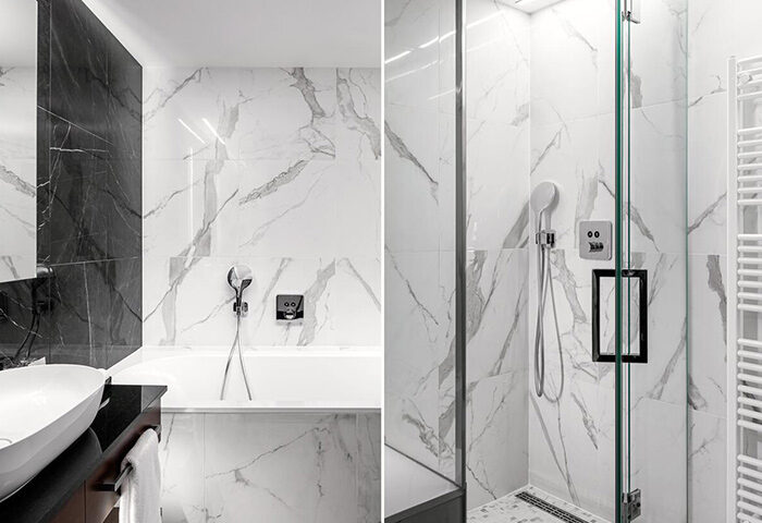 Hotel Kings Court, gay-friendly hotel in Prague Old Town: Modern bathroom with marble tiles, bathtub, and shower. This year's update.