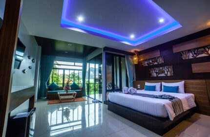 ChaoKoh Phi Phi Hotel & Resort room. Ton Sai Beachfront gay popular hotel with bed, balcony, & view. Luxury Phi Phi hotel for gay travelers.
