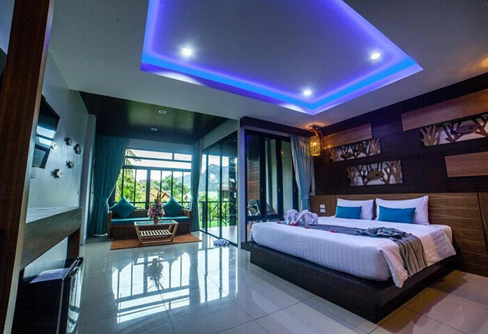 ChaoKoh Phi Phi Hotel & Resort room. Ton Sai Beachfront gay popular hotel with bed, balcony, & view. Luxury Phi Phi hotel for gay travelers.