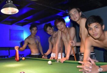 ToolBox Bar, Phnom Penh: Shirtless Asian men pose at a pool table. Gay nightlife in Cambodia. Gay travel advice.