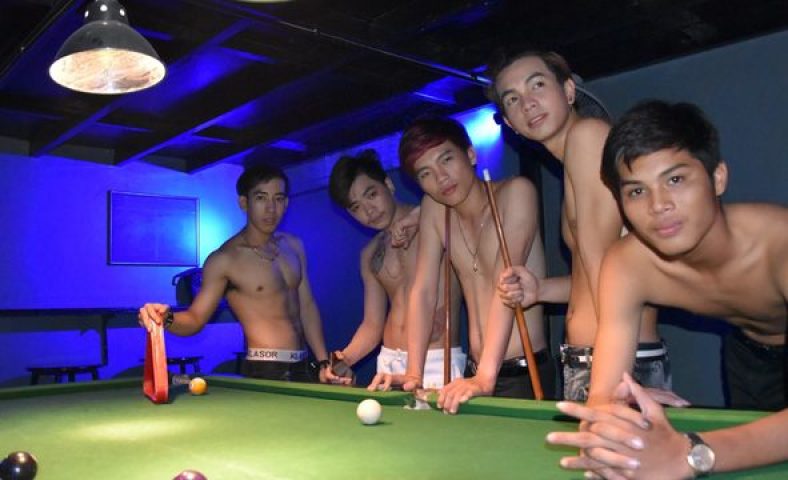ToolBox Bar, Phnom Penh: Shirtless Asian men pose at a pool table. Gay nightlife in Cambodia. Gay travel advice.