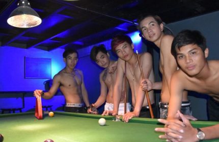 ToolBox Bar, Phnom Penh: Shirtless Asian men pose at a pool table. Gay nightlife in Cambodia. Gay travel advice.