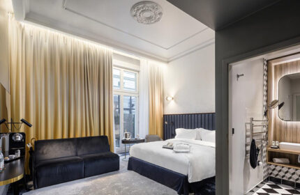 Hotel Century Old Town Prague MGallery room. Gay honeymoon suite with bed, sofa, and bathroom. Luxury Prague hotel for gay travelers.