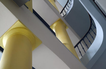 Staircase detail at The Icon Hotel and Lounge, Prague. Instagram-perfect design with golden columns, a top gay hotel. Interior architecture.