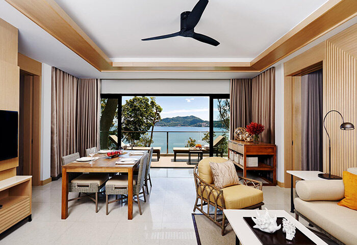 Amari Phuket, Thailand: Beachfront suite interior. Gay honeymooners' hotel with ocean view, dining table, and stylish decor. Top destination.