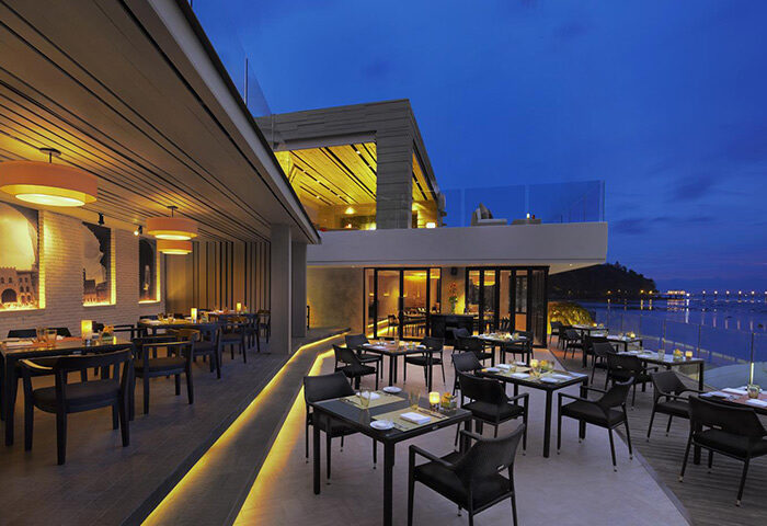 Amari Phuket's romantic beachfront restaurant. Top Thailand dining spot with sea view. Perfect for gay couples seeking luxury travel.