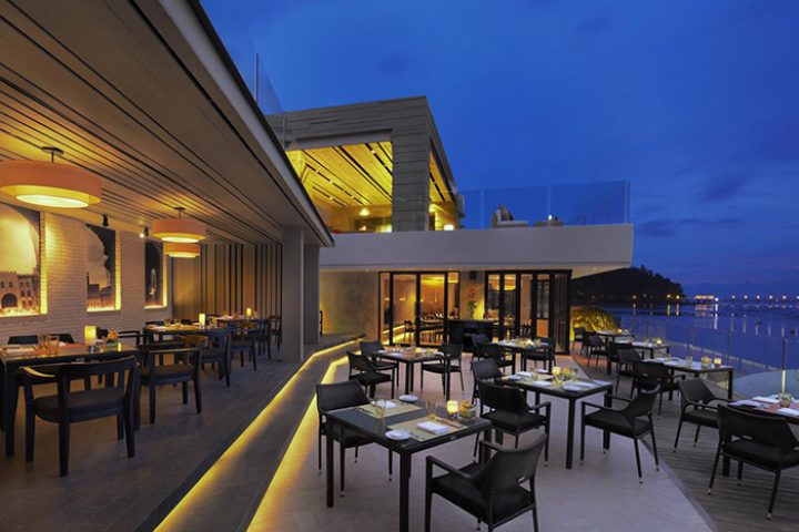 Amari Phuket's romantic beachfront restaurant. Top Thailand dining spot with sea view. Perfect for gay couples seeking luxury travel.