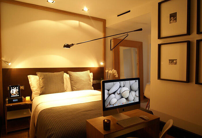 Browns Downtown Hotel room, Lisbon. Cool design with a bed, desk, and computer. Gay hotel in Lisbon city center. Top hotel for gay men travel.
