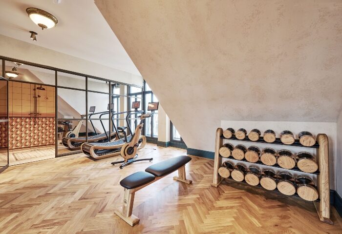 Hotel MOTTO's top fitness center in Vienna. Gay-popular hotel with treadmills, exercise bike, weights, bench, and shower. Boutique hotel gym.