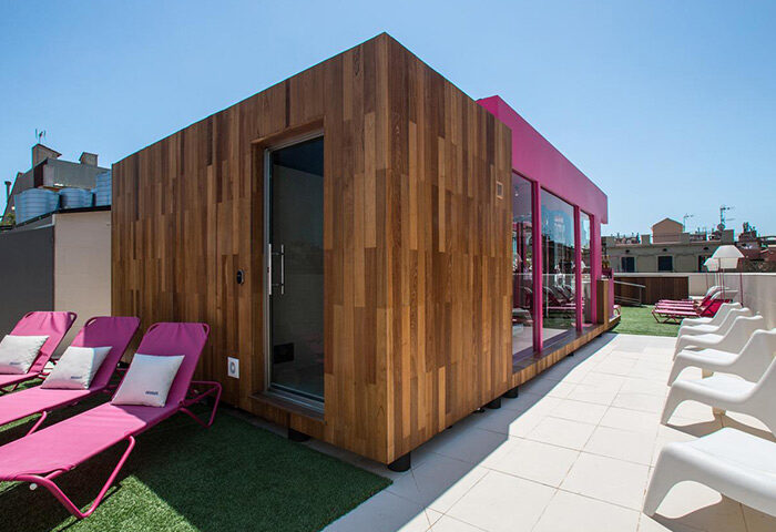 Rooftop at TWO Hotel Barcelona by Axel, an adults-only gay hotel. Lounge chairs near a sauna. Top gay nightlife & saunas nearby.