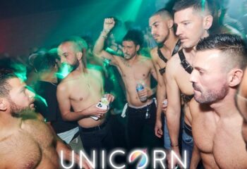 Union Club: Go-go boys at Unicorn, a top gay dance club in London. Late night party scene, shirtless men, and vibrant nightlife.