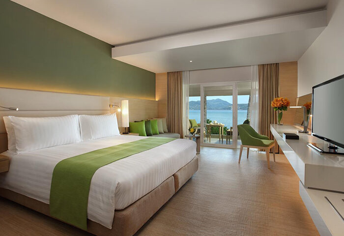 Amari Phuket beachfront hotel room. Gay honeymoon suite near Patong Beach, Thailand. Ocean view balcony, king bed, modern decor.