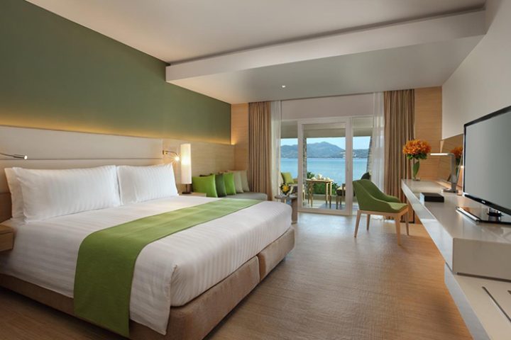 Amari Phuket beachfront hotel room. Gay honeymoon suite near Patong Beach, Thailand. Ocean view balcony, king bed, modern decor.