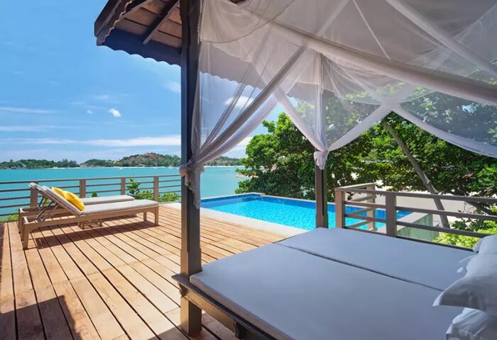 Garrya Tongsai Bay Samui honeymoon suite. Top gay hotel in Koh Samui with ocean view, pool, and canopy bed. Perfect for gay couples.