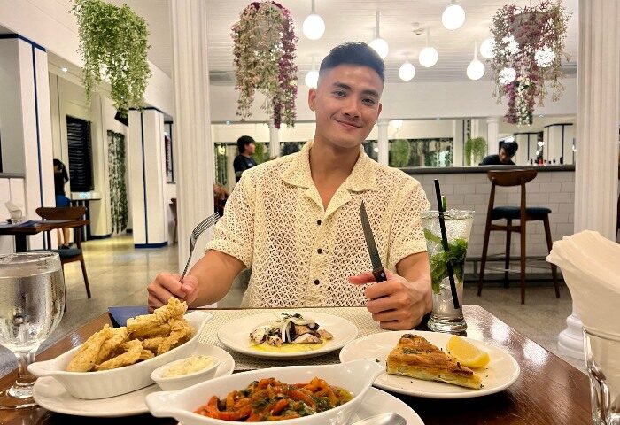 Gay man enjoying fine dining at Double-Six Luxury Hotel Seminyak, Bali. Top gay hotel in Bali with delicious food and a great atmosphere.