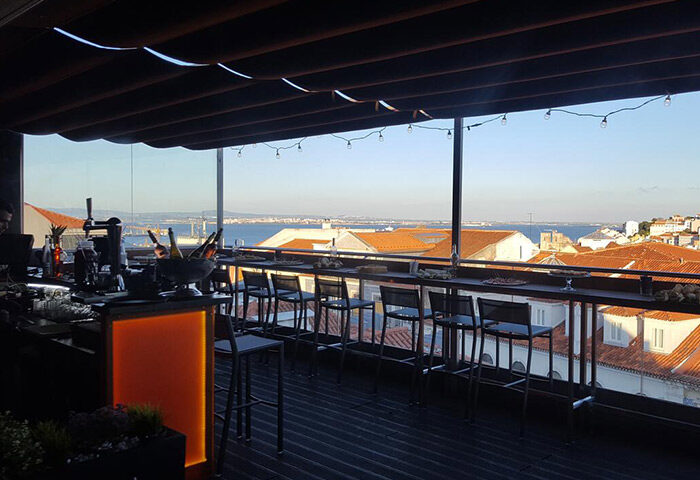 9Hotel Mercy's rooftop bar, a top gay Lisbon hotel. Enjoy stunning city views from the bar. Perfect for gay travel in Lisbon.