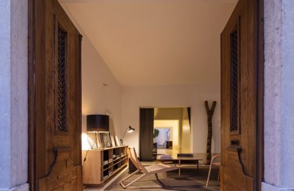 The Late Birds Lisbon, gay urban resort. Interior view through open wooden doors. Stylish design, Lisbon gay hotel.