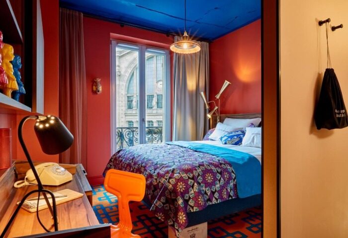 25hours Hotel Terminus Nord room. Bright, colorful decor in this top gay Paris hotel. View of the city center. Modern, stylish design.