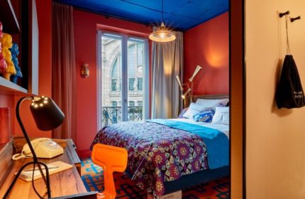 25hours Hotel Terminus Nord room. Bright, colorful decor in this top gay Paris hotel. View of the city center. Modern, stylish design.
