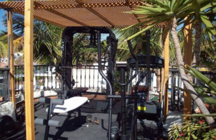 Pasion Tropical Gay Resort gym. Outdoor gym at Playa del Ingles gay men's hotel. Top gay men-only hotel with fitness equipment.