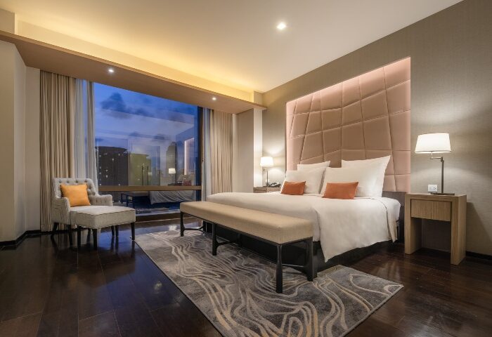 VIE Hotel Bangkok honeymoon suite. Luxury bedroom with king bed, city view. Top hotel for gay travelers seeking romantic getaway.