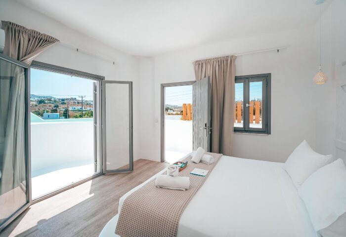 Akkadian Gay Only Hotel Mykonos room. Honeymoon hotels for gay couples. White room with balcony. Gay travel. Mykonos hotel.