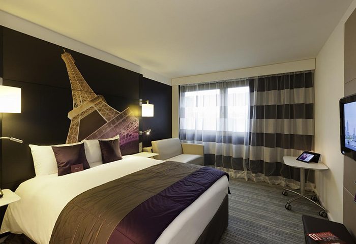 Mercure Paris Centre Tour Eiffel hotel room. Instagram-perfect gay hotel in Paris with Eiffel Tower view, comfy bed, and modern design.