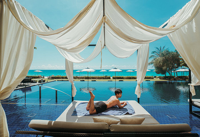 Gay traveler at Vana Belle, a Luxury Collection Resort, Koh Samui. Instagram-perfect hotel with pool, beach, and ocean views in Thailand.