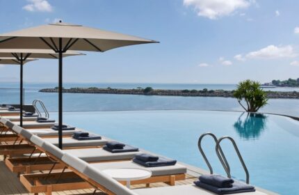 JW Marriott Hotel Istanbul Marmara Sea beachfront pool. Luxury gay travel. Loungers, umbrellas, and ocean views at this top Istanbul hotel.