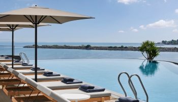 JW Marriott Hotel Istanbul Marmara Sea beachfront pool. Luxury gay travel. Loungers, umbrellas, and ocean views at this top Istanbul hotel.