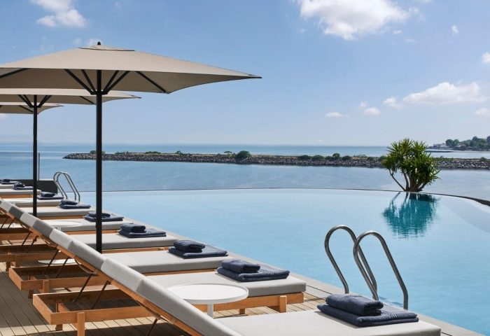 JW Marriott Hotel Istanbul Marmara Sea beachfront pool. Luxury gay travel. Loungers, umbrellas, and ocean views at this top Istanbul hotel.