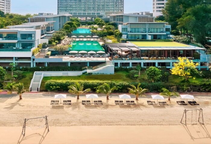 Renaissance Pattaya Resort & Spa, a top luxury beachfront hotel. Gay travel destination with pools, beach chairs, and modern architecture.