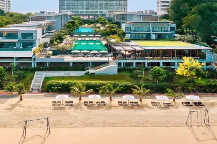 Renaissance Pattaya Resort & Spa, a top luxury beachfront hotel. Gay travel destination with pools, beach chairs, and modern architecture.