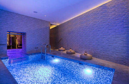 Hotel Kings Court's luxury pool in Prague's Old Town. A top honeymoon spot for gay couples, featuring a modern design and relaxing ambiance.