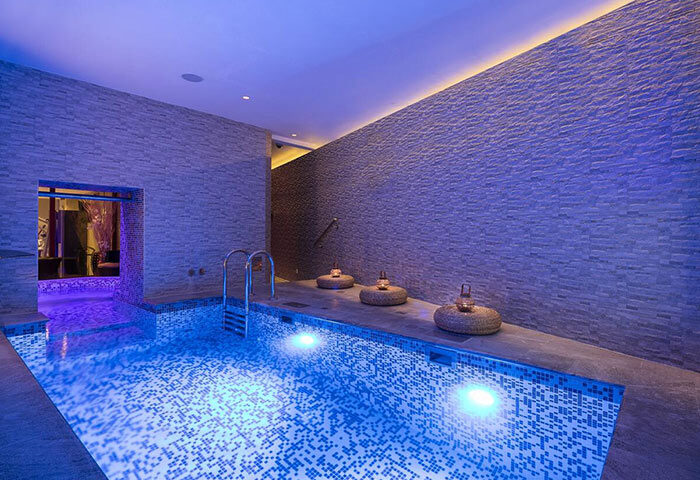 Hotel Kings Court's luxury pool in Prague's Old Town. A top honeymoon spot for gay couples, featuring a modern design and relaxing ambiance.