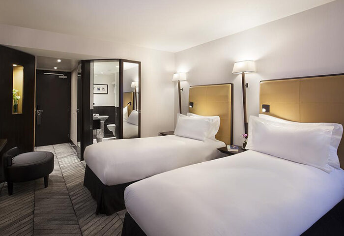 Sofitel Lisbon Liberdade twin room. Top luxury gay hotel in Lisbon city center near gay bars. Modern design, comfortable beds, and stylish bathroom.