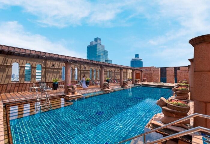 Crowne Plaza Bangkok Lumpini Park rooftop pool. Luxury gay hotels in Bangkok offer stunning views and relaxation for gay travelers.