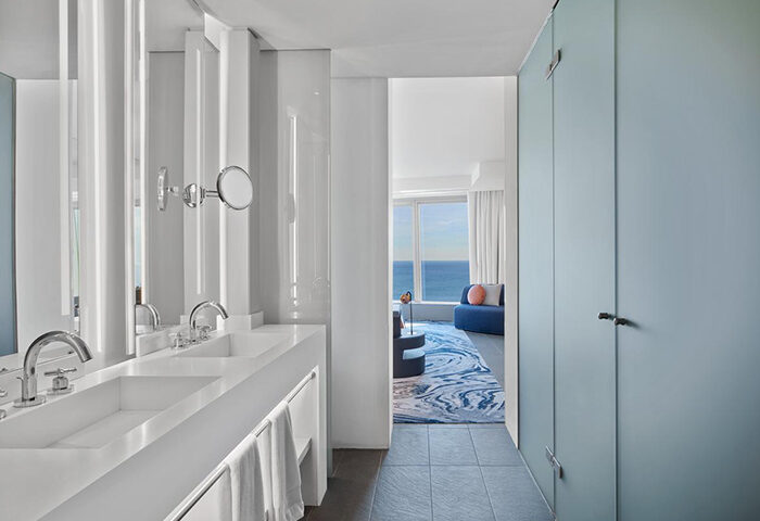 W Barcelona Hotel bathroom. Luxury gay hotel with modern design, double sinks, and ocean view. Top choice for gay travelers in Barcelona.