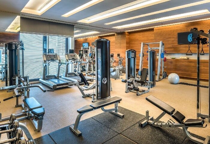Pullman Bangkok King Power gym. Luxury wellness hotel near gay bars in Bangkok. Treadmills, weights, & machines for a complete workout.