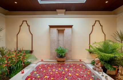 InterContinental Pattaya Resort wellness suite. Top luxury gay beachfront hotel bathtub filled with flowers. Relaxing spa day.